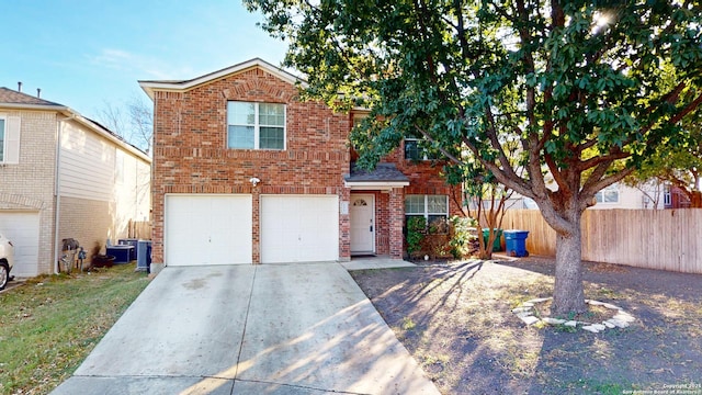 view of front property featuring a garage and central air condition unit