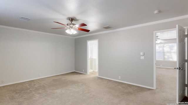 unfurnished room with light carpet and crown molding