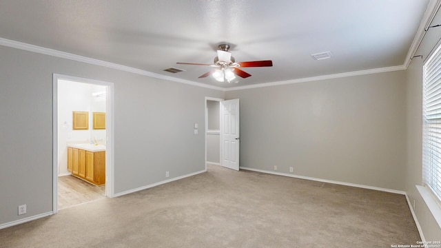 unfurnished bedroom with ceiling fan, crown molding, light carpet, and connected bathroom