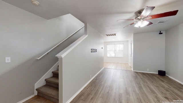 interior space with light hardwood / wood-style flooring and ceiling fan