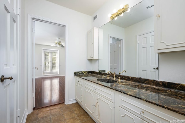 bathroom featuring vanity and ceiling fan