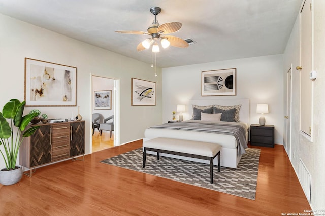 bedroom featuring hardwood / wood-style flooring and ceiling fan