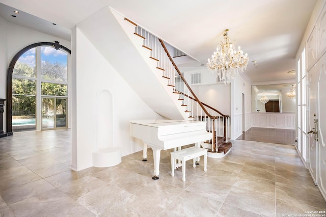 foyer with a chandelier