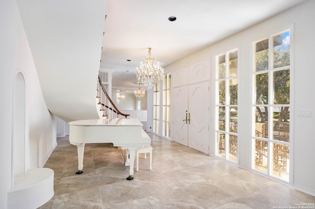 foyer with a notable chandelier