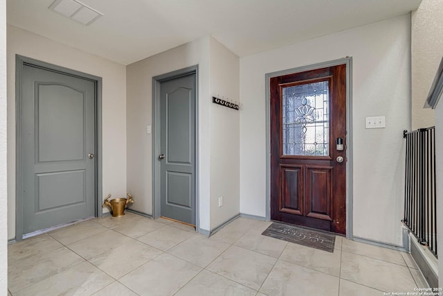 entrance foyer with light tile patterned flooring