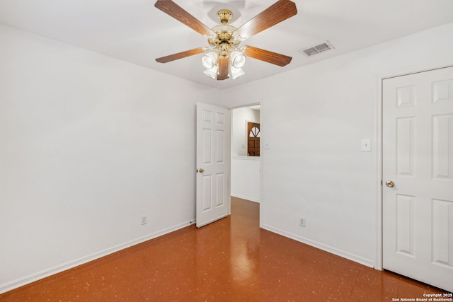 spare room with ceiling fan