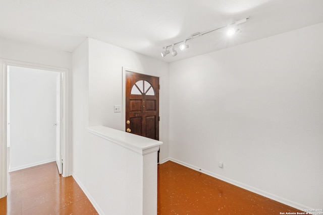 foyer featuring track lighting