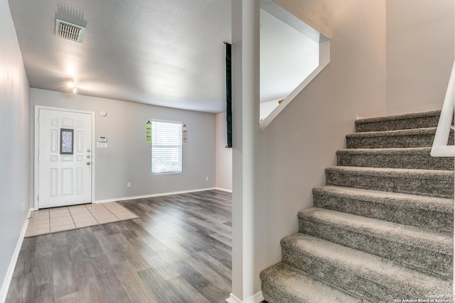 foyer featuring wood-type flooring