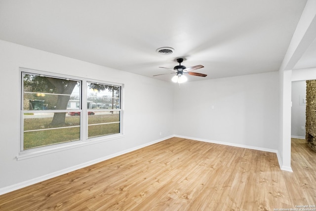 empty room featuring ceiling fan and light hardwood / wood-style floors