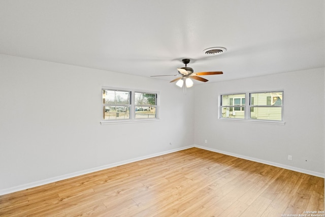 spare room with light hardwood / wood-style flooring