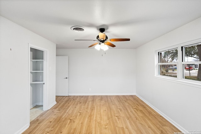 spare room with light hardwood / wood-style flooring and ceiling fan