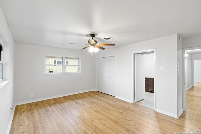 unfurnished bedroom with ceiling fan and light hardwood / wood-style floors