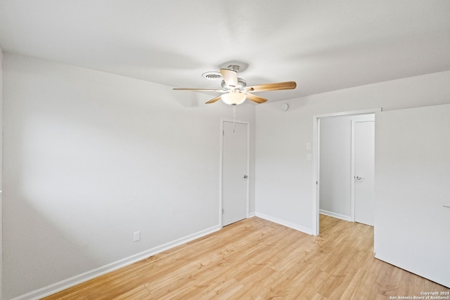 empty room with light hardwood / wood-style flooring