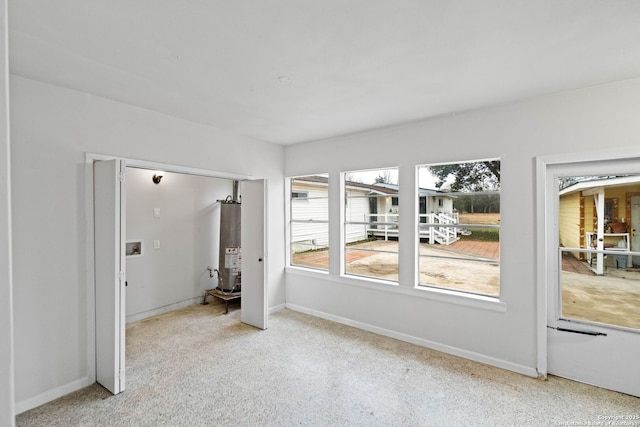 empty room featuring gas water heater