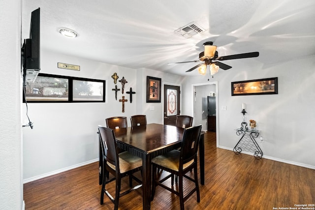 dining area featuring dark hardwood / wood-style floors and ceiling fan