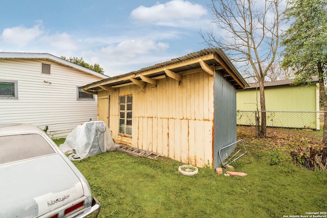 view of side of home featuring a yard