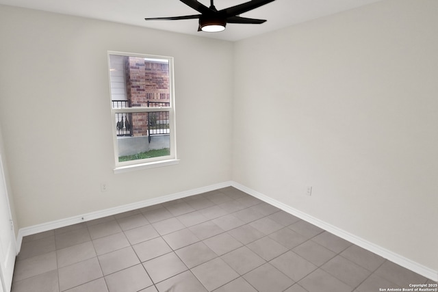 empty room featuring light tile patterned floors and ceiling fan