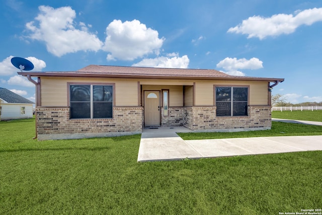 view of front facade with a front yard and a patio area