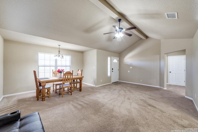 carpeted living room with a textured ceiling, vaulted ceiling with beams, and ceiling fan with notable chandelier