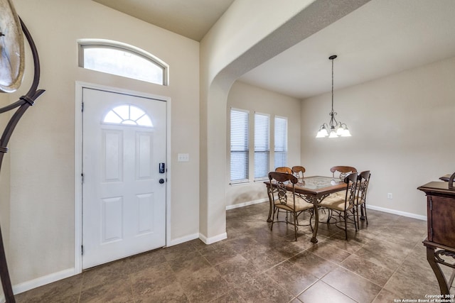 entryway with plenty of natural light and a notable chandelier