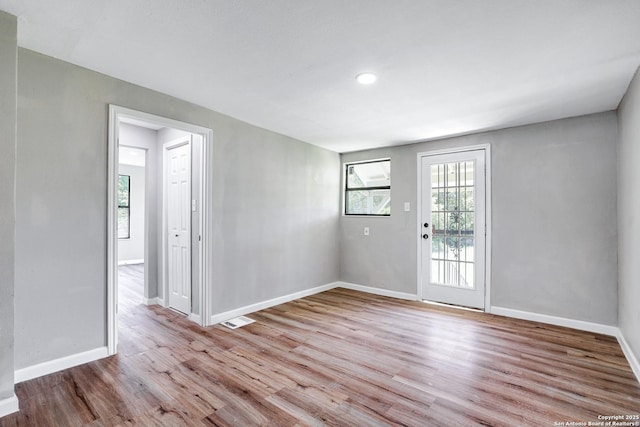 empty room with light wood-type flooring