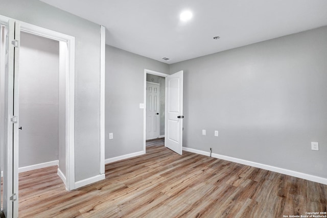 unfurnished bedroom featuring light hardwood / wood-style floors