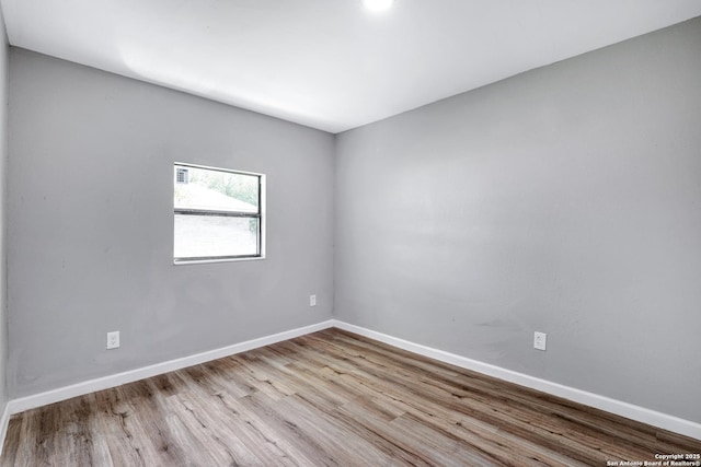 spare room featuring light wood-type flooring