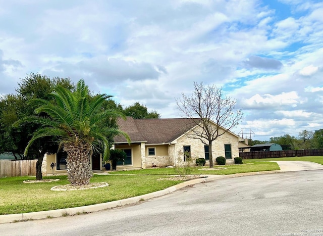 ranch-style house with a front lawn