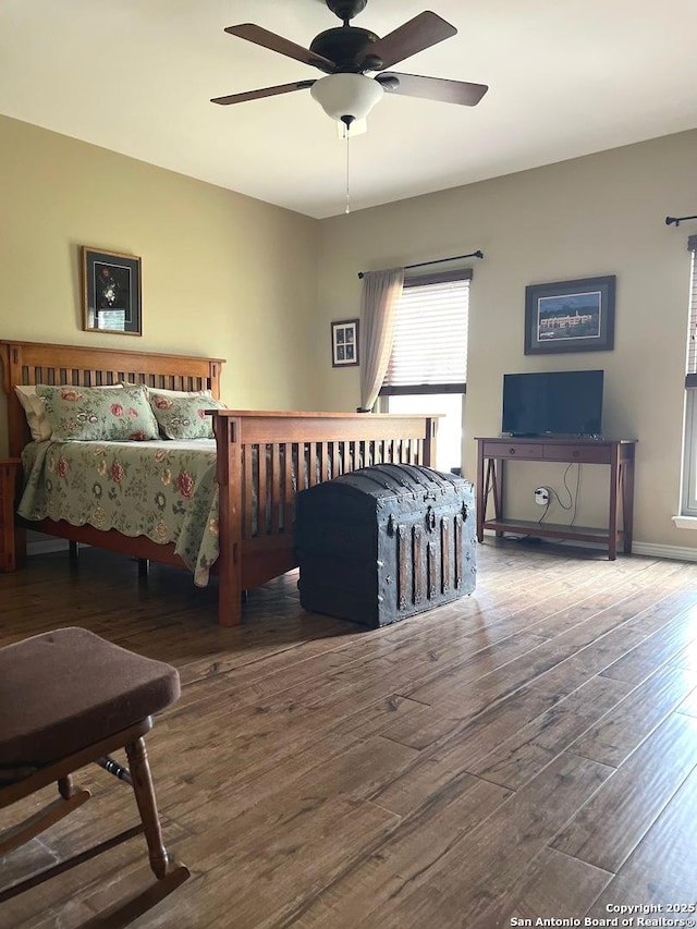 bedroom featuring hardwood / wood-style flooring and ceiling fan