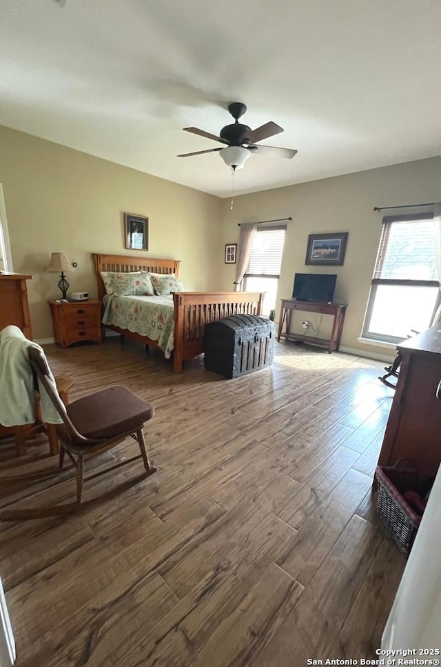 bedroom with ceiling fan and wood-type flooring