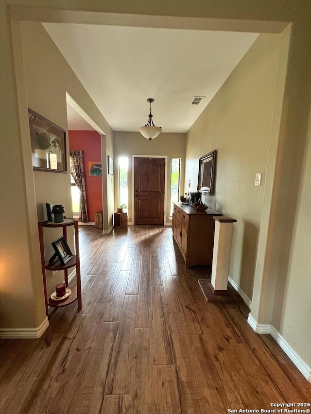 entryway with dark hardwood / wood-style floors