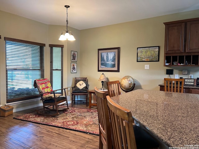 dining room featuring a chandelier and wood-type flooring