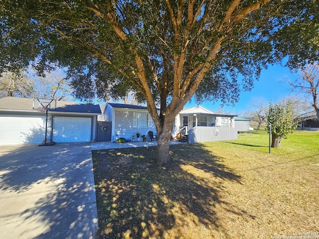 ranch-style home featuring a front yard and a garage