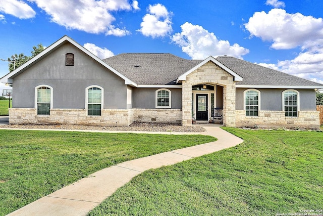 french country style house with a front lawn