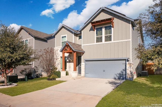 view of front of home with central air condition unit, a front lawn, and a garage