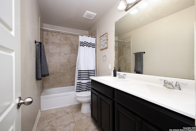 full bathroom featuring tile patterned flooring, shower / bath combo, vanity, and toilet