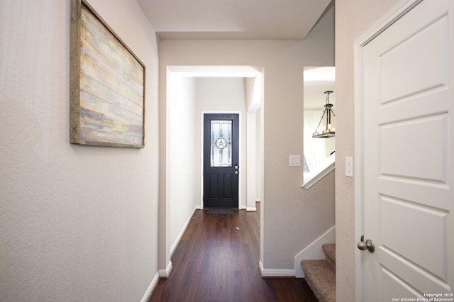 corridor with dark wood-type flooring