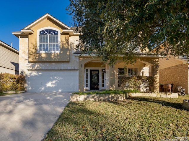 view of front of home featuring a garage and a front lawn