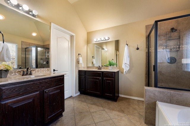 bathroom with separate shower and tub, tile patterned floors, vanity, and lofted ceiling