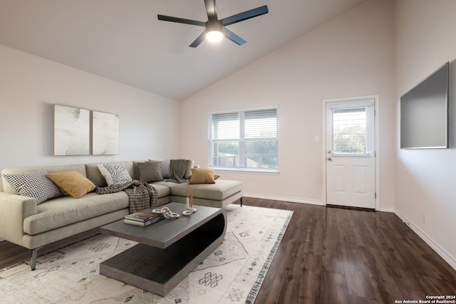 living room featuring ceiling fan, dark wood-type flooring, and high vaulted ceiling