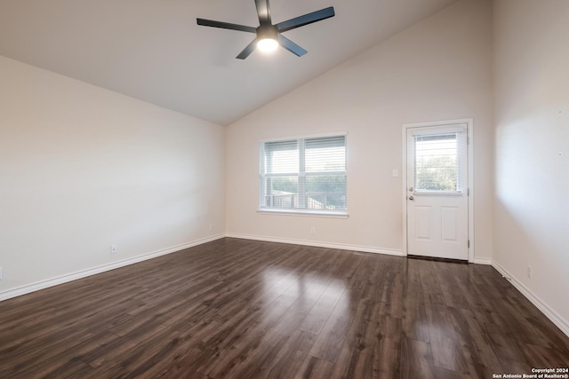 empty room featuring high vaulted ceiling, ceiling fan, and dark wood-type flooring