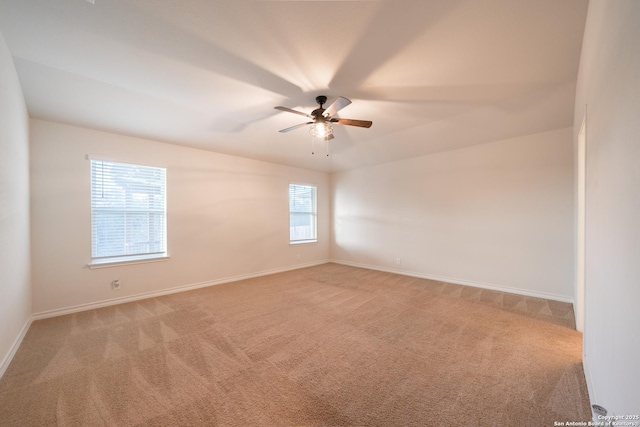 spare room featuring carpet and ceiling fan