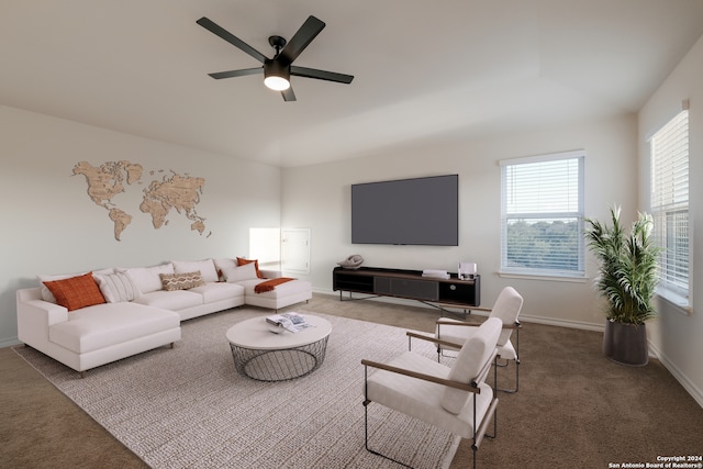 living room with carpet, ceiling fan, and a healthy amount of sunlight