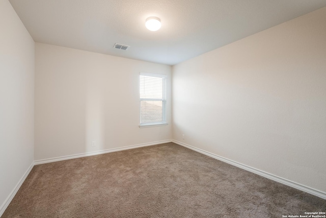 unfurnished room featuring carpet flooring