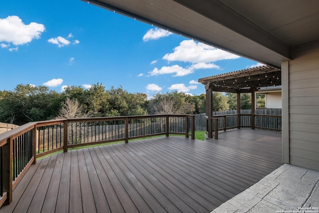 wooden deck featuring a pergola