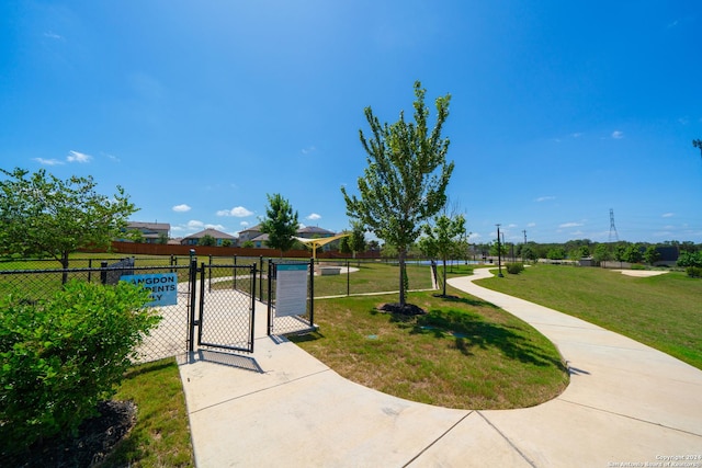 view of home's community featuring a lawn