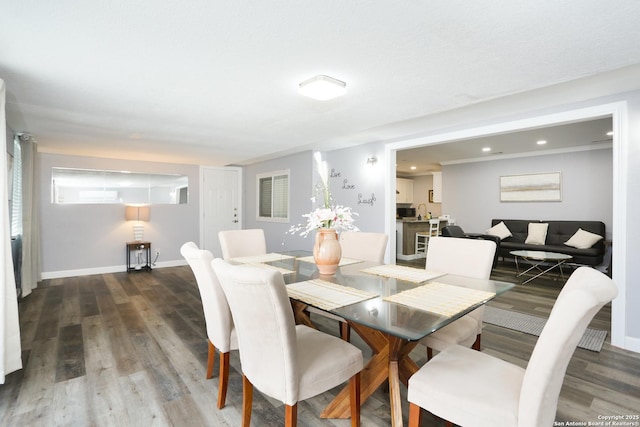 dining space with dark hardwood / wood-style floors