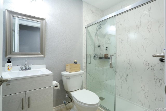 bathroom with vanity, toilet, and walk in shower