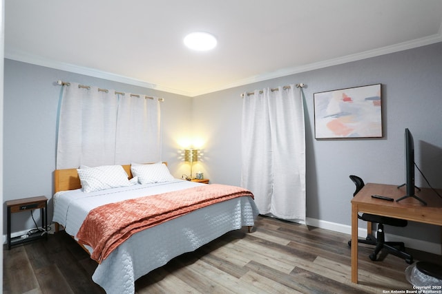 bedroom featuring hardwood / wood-style flooring and ornamental molding