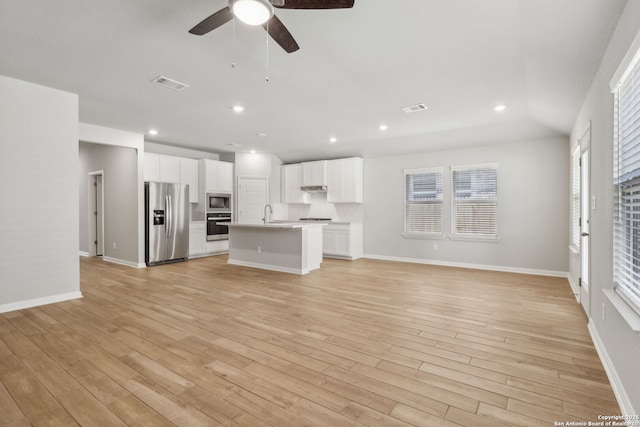 unfurnished living room featuring ceiling fan, light wood-type flooring, and lofted ceiling